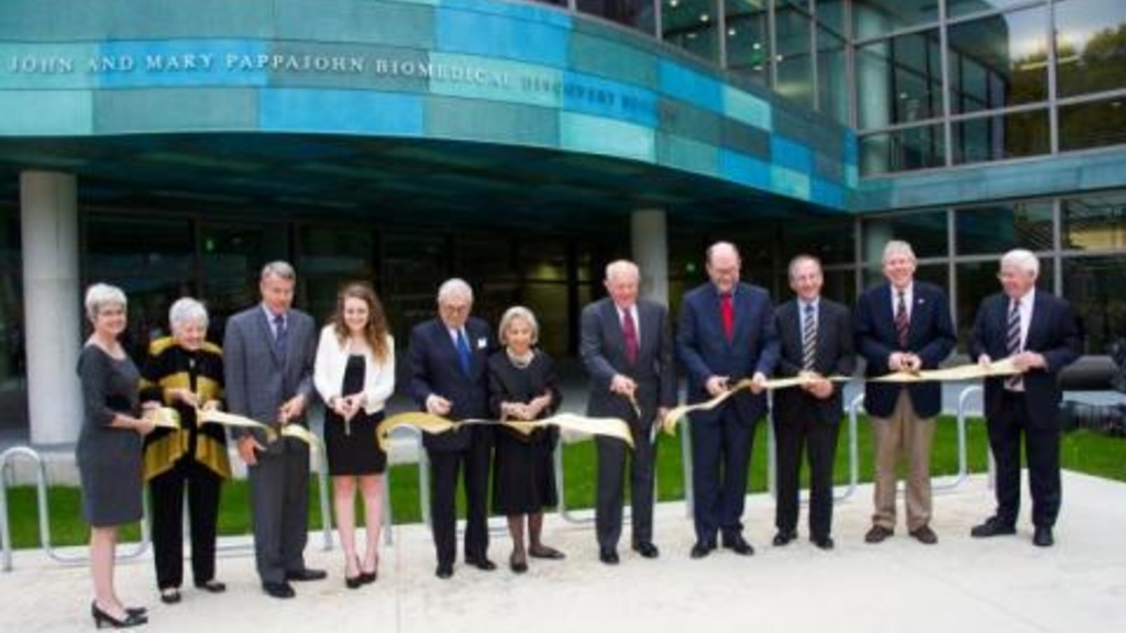 Ribbon cutting outside of new PBDB building 